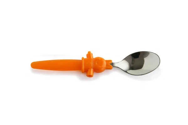 Stříbrná lžíce s oranžová plastová rukojeť — Stock fotografie