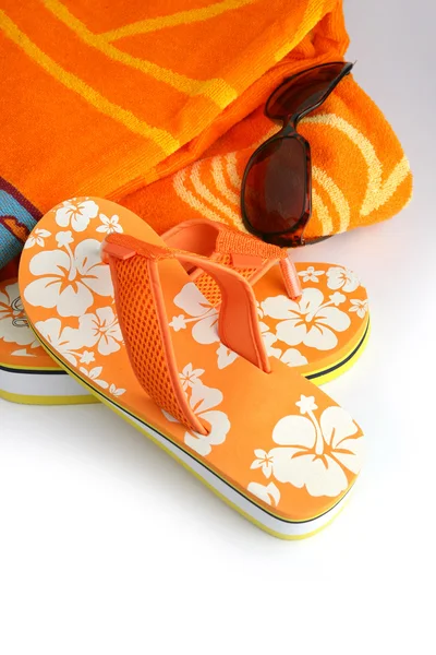 Flip-flops, sunglasses and towel — Stock Photo, Image