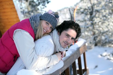 Happy couple at ski resort clipart