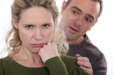 Man trying to comfort his grumpy wife clipart