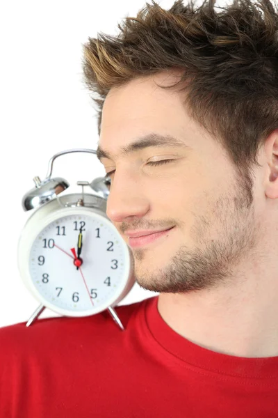 Young man with a clock on his shoulder — Stock Photo, Image