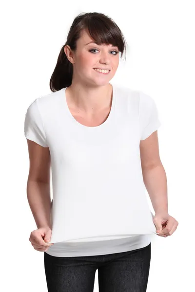 Atractiva chica joven probándose una camisa — Foto de Stock