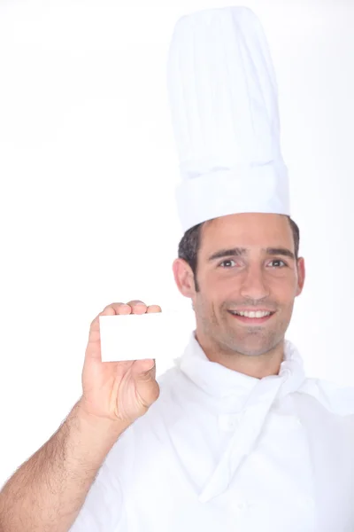Chef with a blank business card — Stock Photo, Image