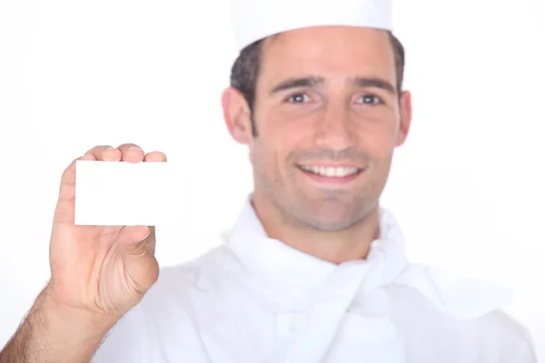 Chef holding a call card — Stock Photo, Image