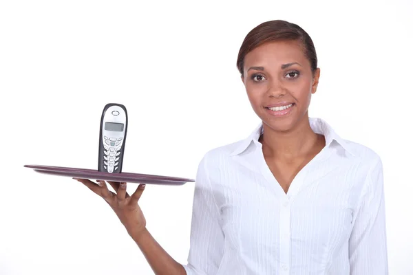 Waitress with telephone on a tray — Stock Photo, Image