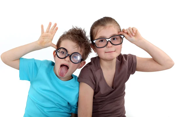 Children wearing funky glasses Stock Photo
