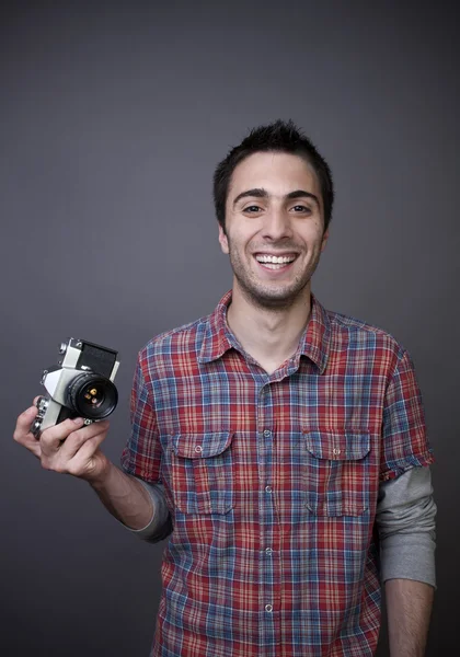 Young man with photo camera — Stock Photo, Image