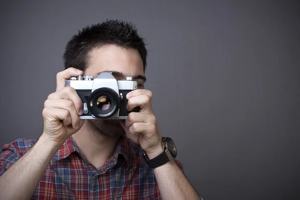 Young man with retro photo camera — Stock Photo, Image