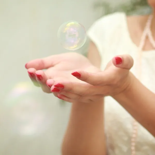Bubble in hands — Stock Photo, Image