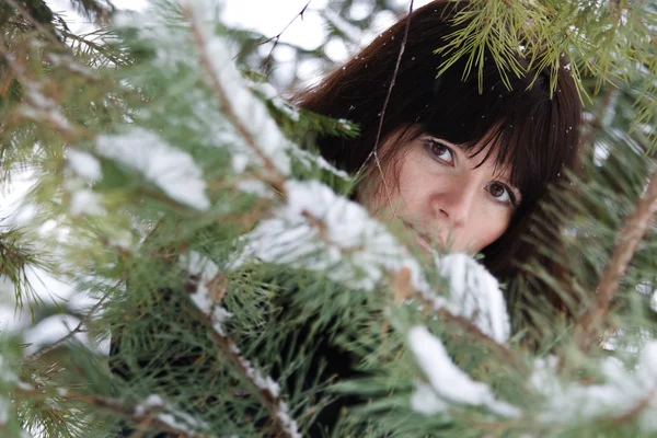 Closeup portrait of a young girl on the background of the winter — Stock Photo, Image