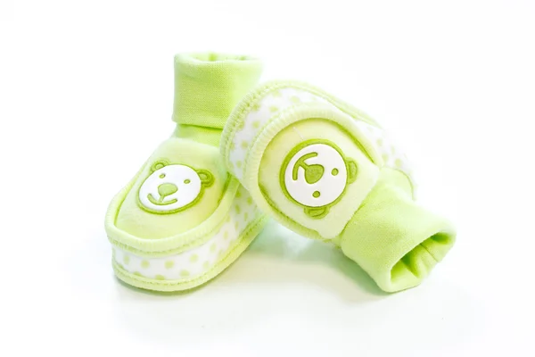 stock image Green baby booties with dots