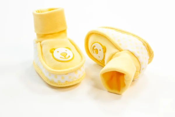 Yellow baby booties with dots Stock Image