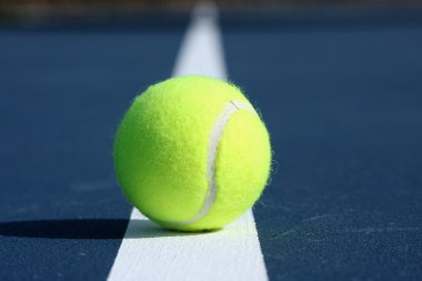 Tennis Ball Centered on the Court Line