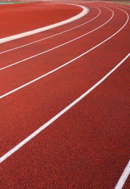 Curve of a Red Running Track clipart