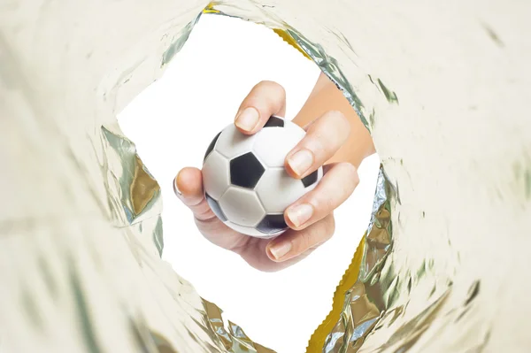 Ball on Hand in plastic snack pack — Stock Photo, Image