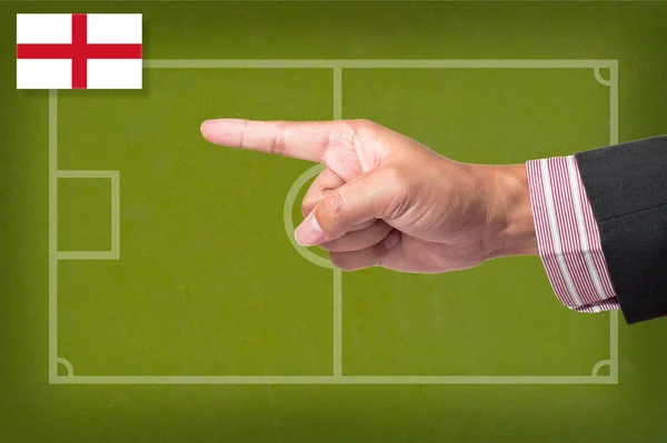 Hand zeigt eine Fußballspiel-Strategie auf eine Tafel — Stockfoto