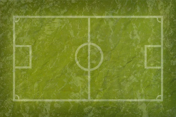 Voetbal voetbal op papier grasveld — Stockfoto