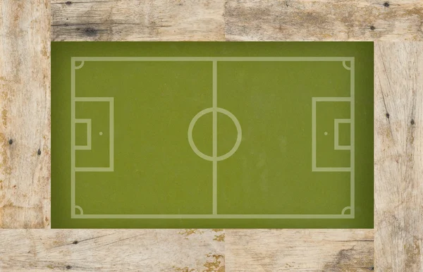 Modellera fotboll fotboll på trä bakgrund — Stockfoto