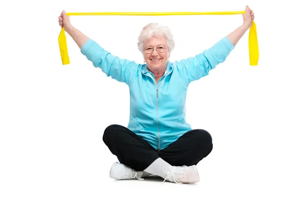 Äldre kvinna på gym — Stockfoto