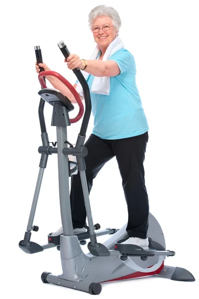 Mujer mayor haciendo ejercicio en stepper —  Fotos de Stock