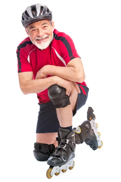 Uomo anziano pattinaggio in linea — Foto Stock