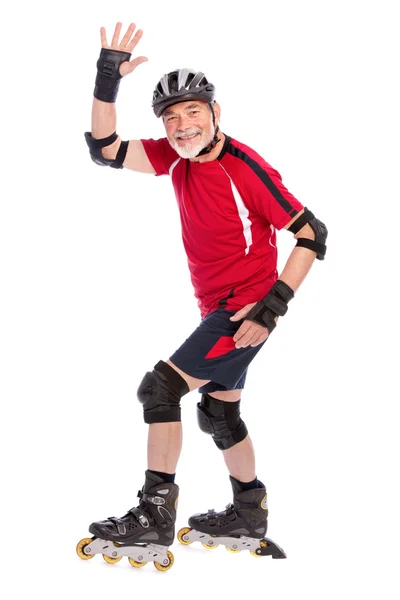 Senior man inline skating — Stock Photo, Image