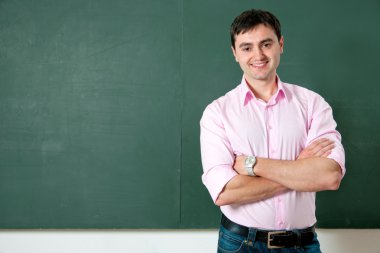 Student or teacher at the blackboard clipart