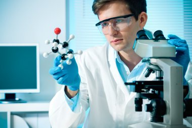 Scientist working at the laboratory clipart