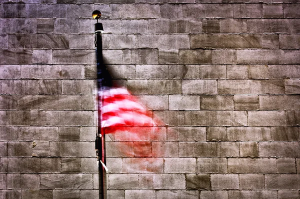 American flag by wall — Stock Photo, Image