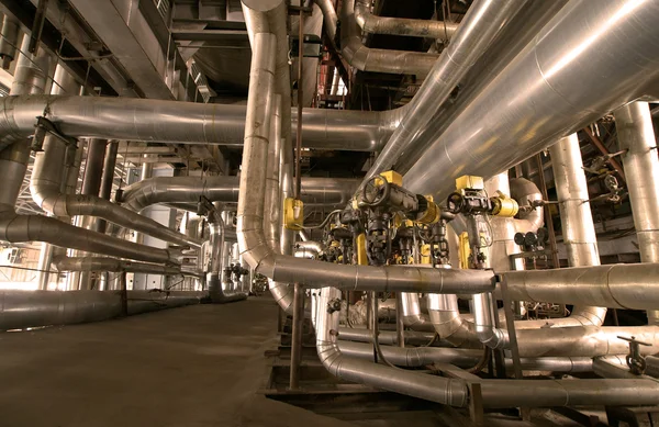 Industrial zone, Steel pipelines and cables in yellow tones — Stock Photo, Image