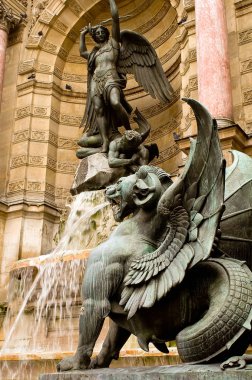 Detail of the Saint Michel fountain in Paris 1 clipart
