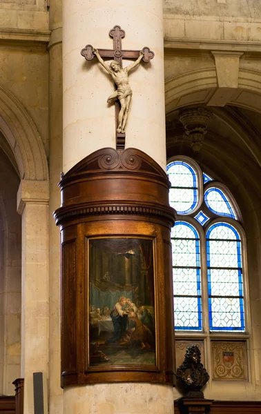 Crucifix with painting on the column — Stock Photo, Image
