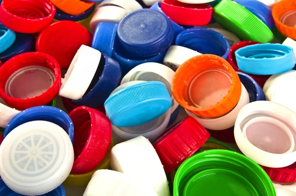 Kleurrijke plastic deksels — Stockfoto