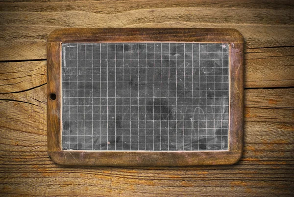 Old blackboard and wooden background — Stock Photo, Image
