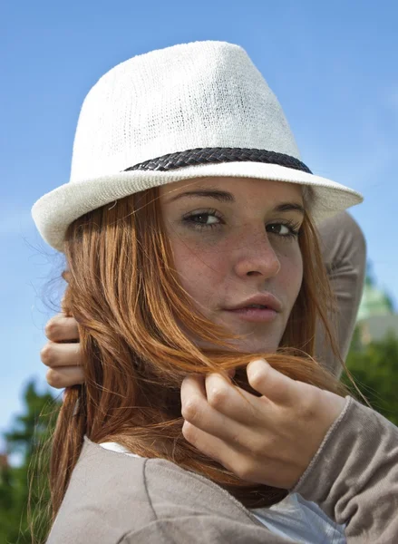Pretty young woman with white hat looks sexy — Stock Photo, Image