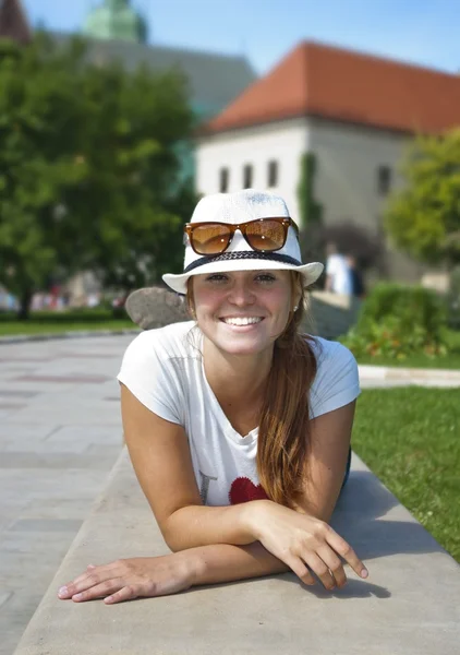 stock image Portrait of the young beautiful smiling woman outdoors