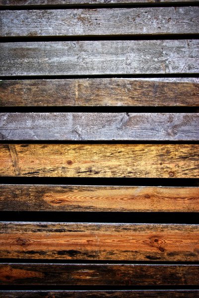 Dark wet wood texture with cracks