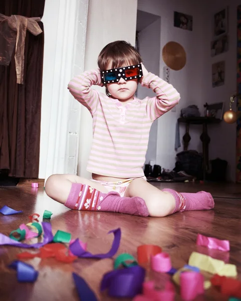 stock image Child whit 3d glasses on a wooden floor.