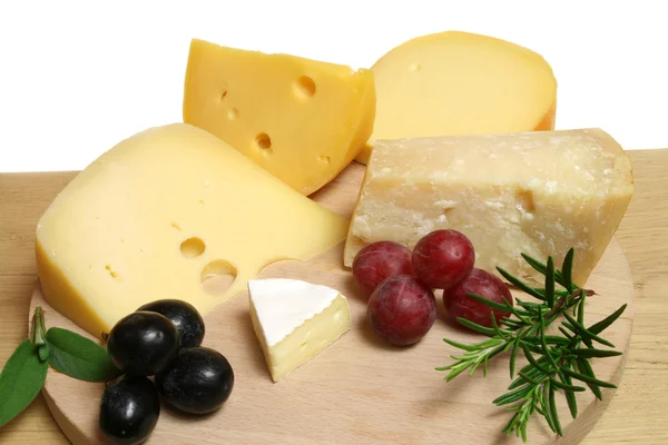 Cheeses and grapes — Stock Photo, Image