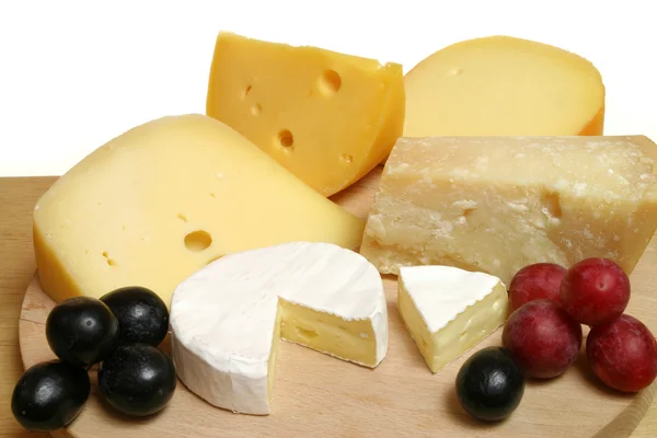 Cheeses and grapes — Stock Photo, Image