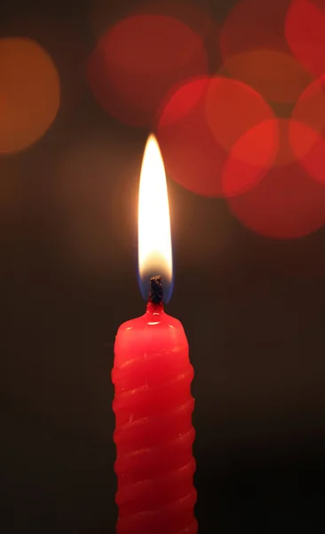 Red candle on dark background — Stock Photo, Image