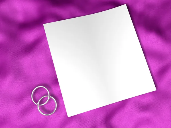 Белая бумага и обручальное кольцо — стоковое фото