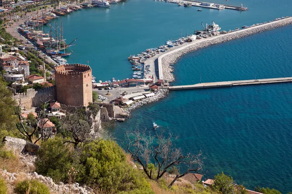 Turkey, Alanya - red tower and harbor — Stock Photo, Image