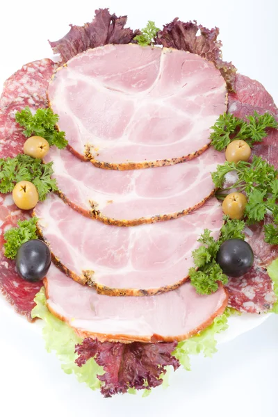 Snijden vlees op een feestelijke tafel. — Stockfoto