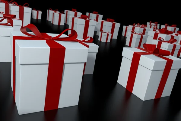 Fehér ajándék dobozok, vörös szalagok — Stock Fotó