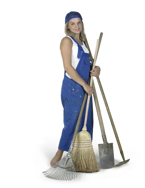 Linda chica vestida con ropa de trabajo con un montón de herramientas de jardinería —  Fotos de Stock