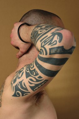 Tribal tattoo on arm clipart