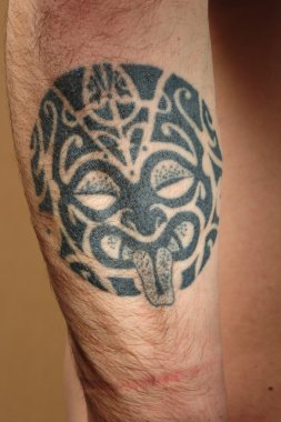 Tribal tattoo on arm clipart