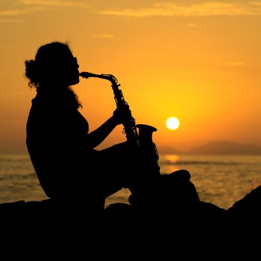 Woman Playing the Saxophone at Sunset clipart