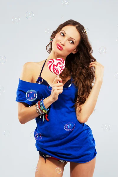 Lovely woman with a lollipop — Stock Photo, Image